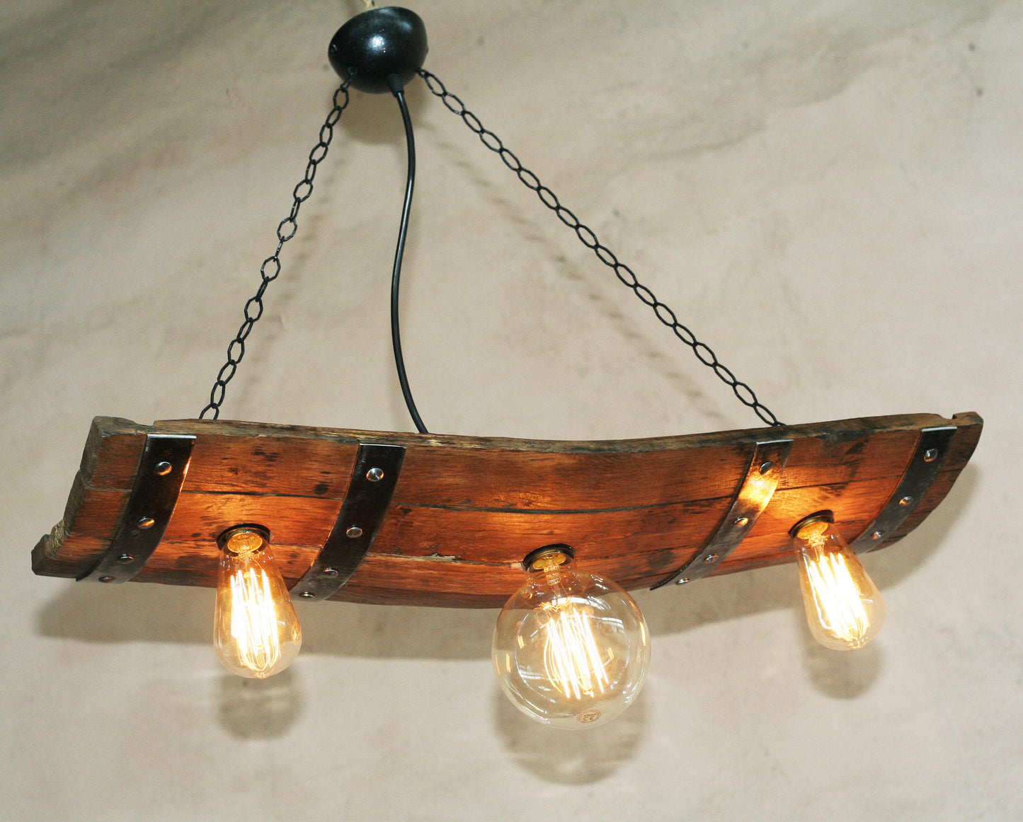 Reclaimed oak wine barrel ceiling light close up natural wood grain