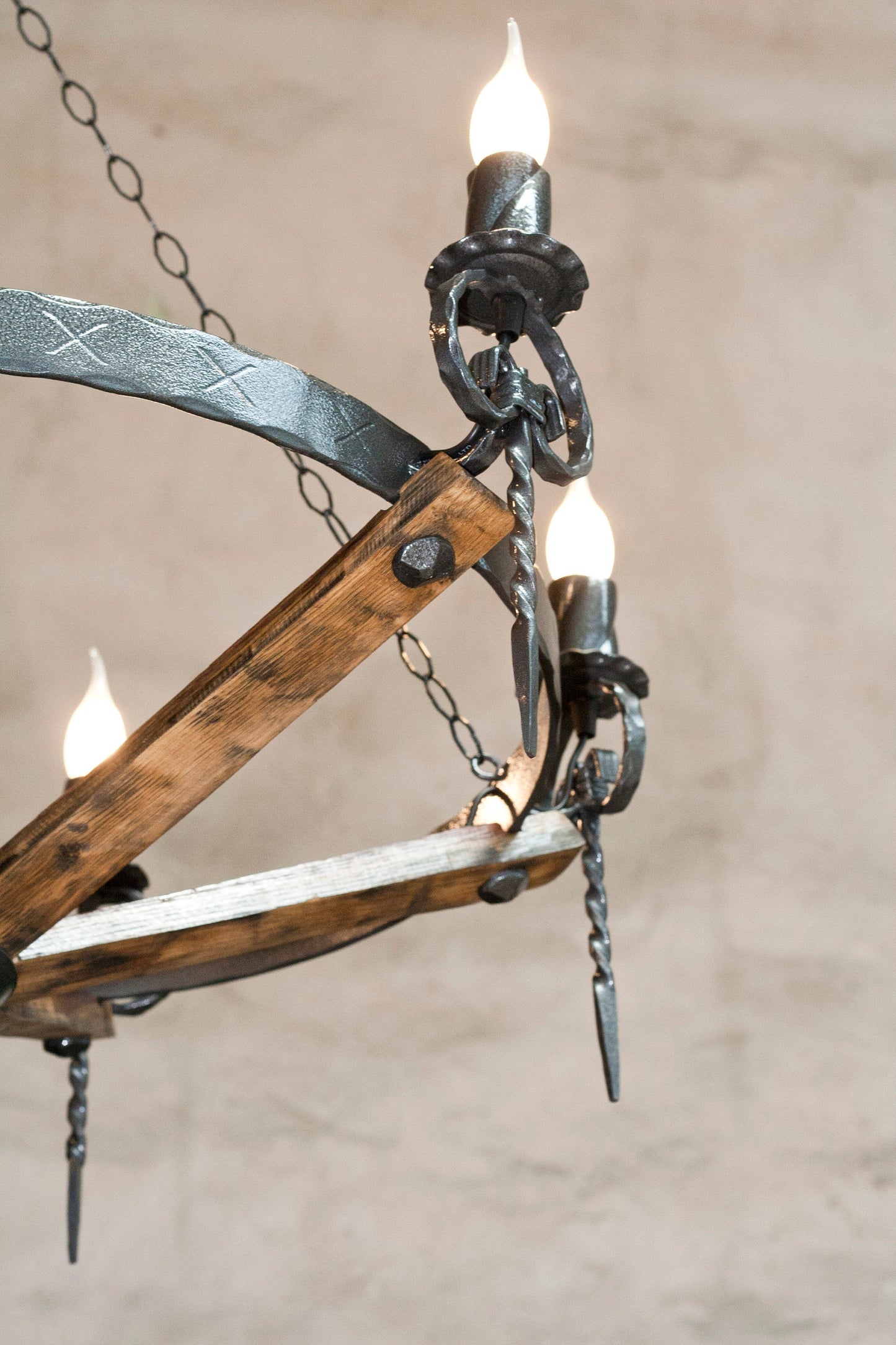 Handcrafted wrought iron chandelier close up wine barrel stave