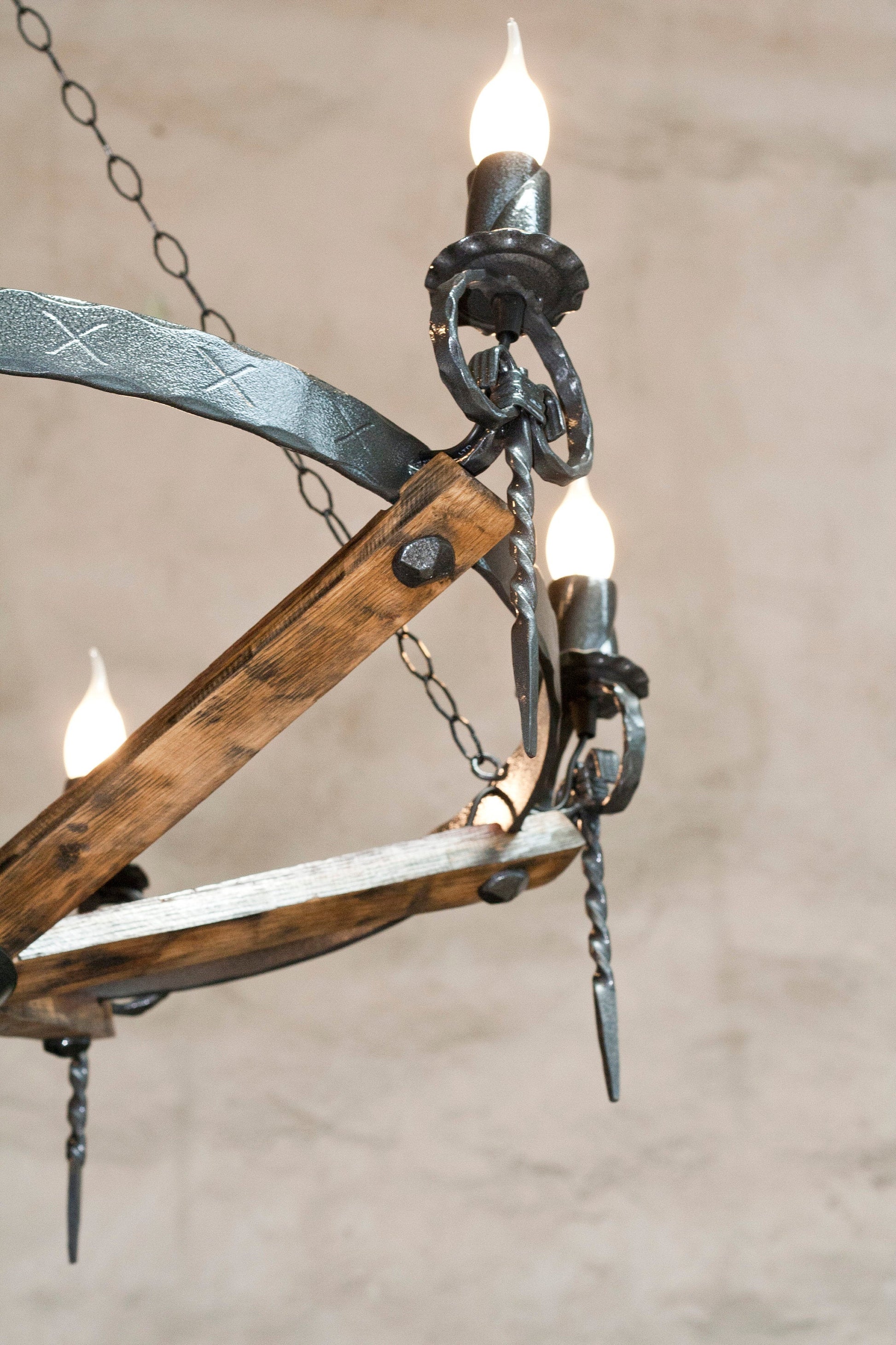 Handcrafted wrought iron chandelier close up wine barrel stave