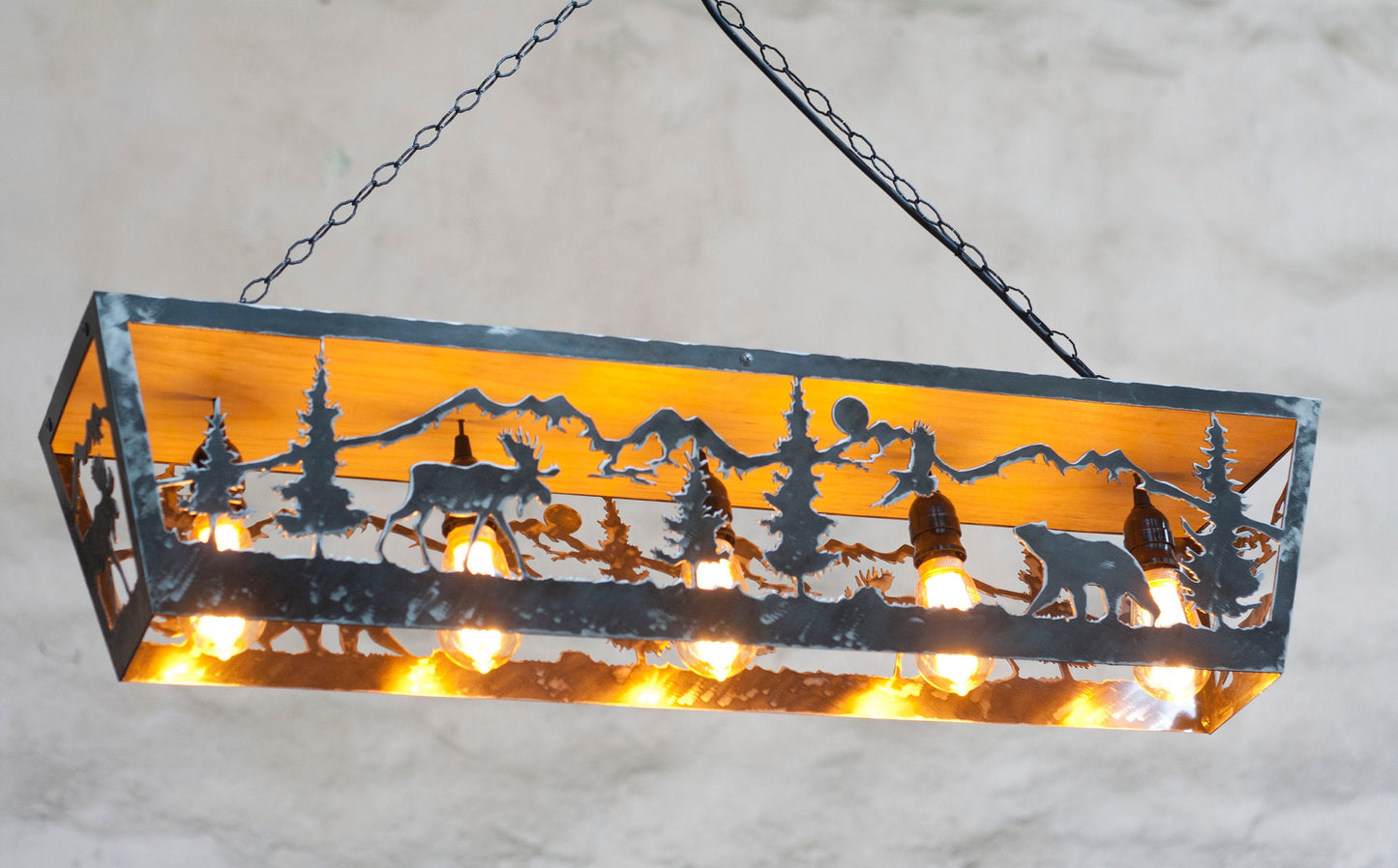 Handcrafted moose bear silhouette ceiling light close up