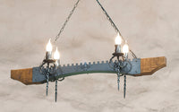 Chandelier lighting. Ceiling lights. Wrought iron chandelier. Four light wood and iron chandelier. Rustic ceiling lights.