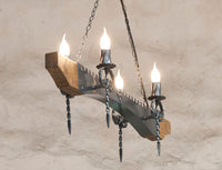 Chandelier lighting. Ceiling lights. Wrought iron chandelier. Four light wood and iron chandelier. Rustic ceiling lights.