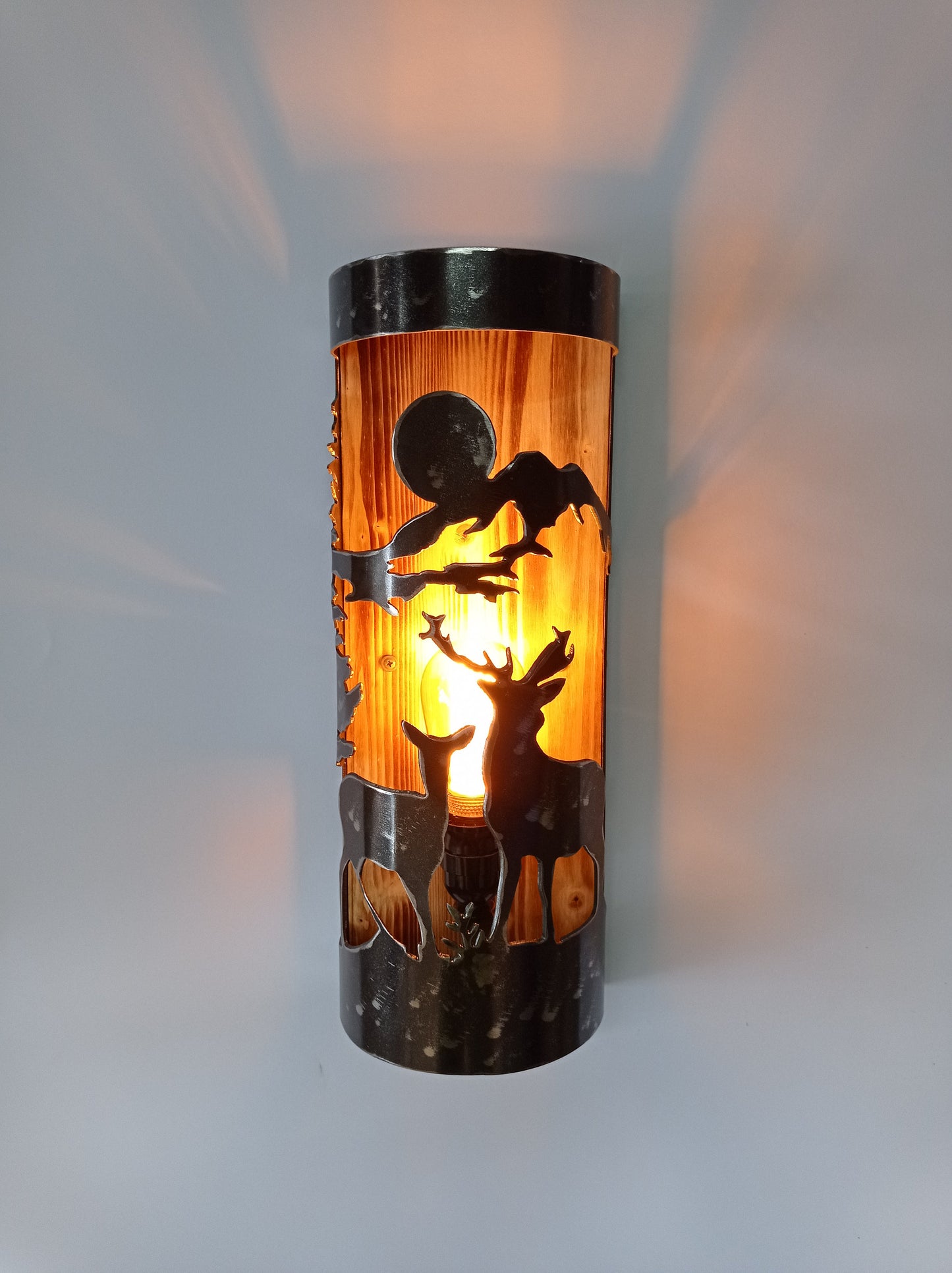 Handmade lodge wall light with deer pair cutout, burned wood and brushed steel finish