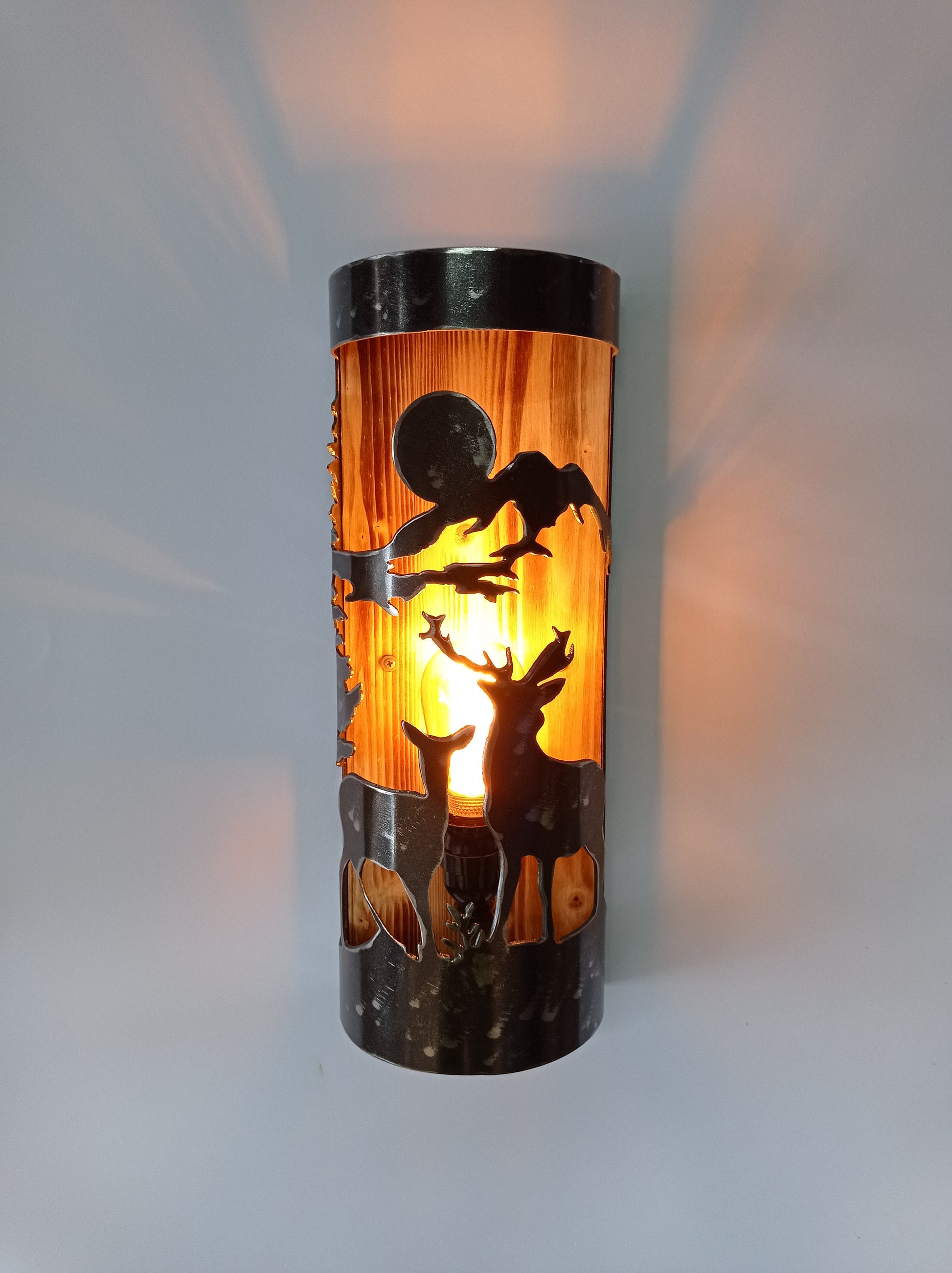 Handmade lodge wall light with deer pair cutout, burned wood and brushed steel finish