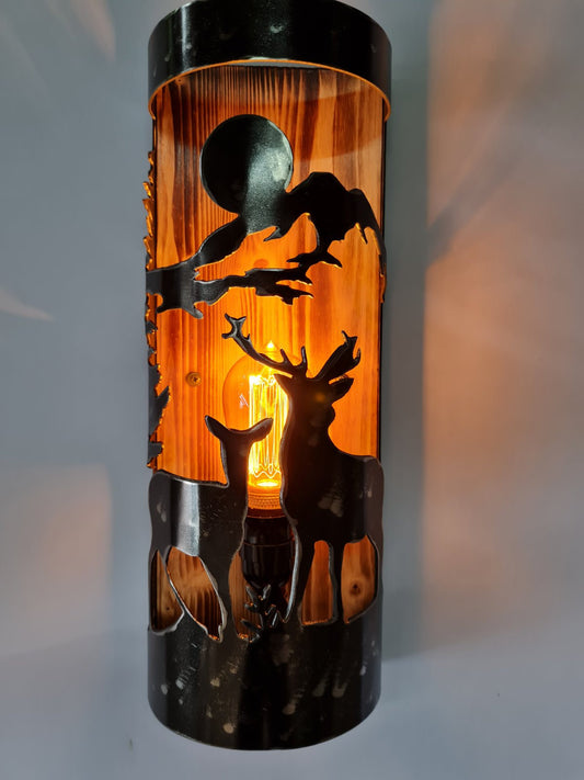 Rustic wood and steel wall sconce with buck and doe silhouette, cabin lighting