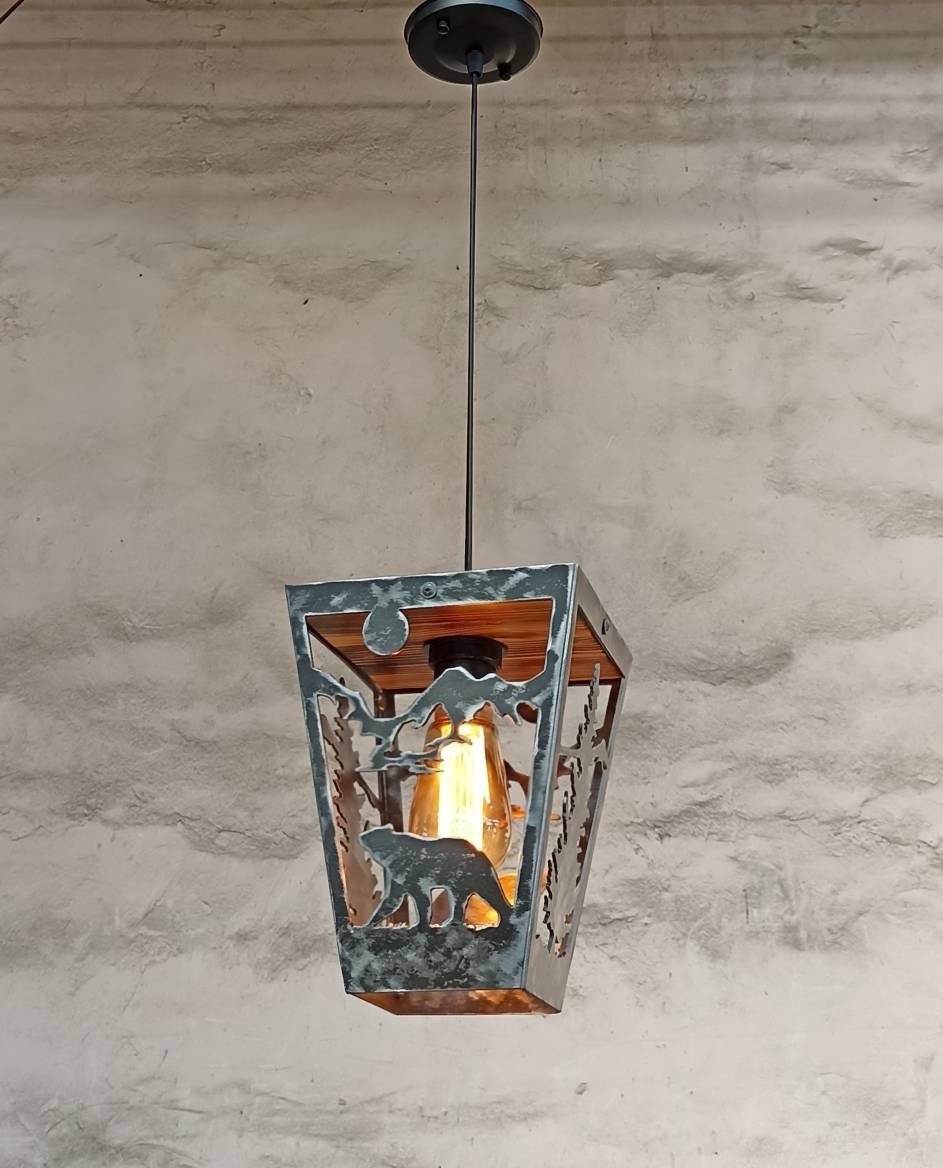 Bear mountain cabin pendant light illuminated amber bulb