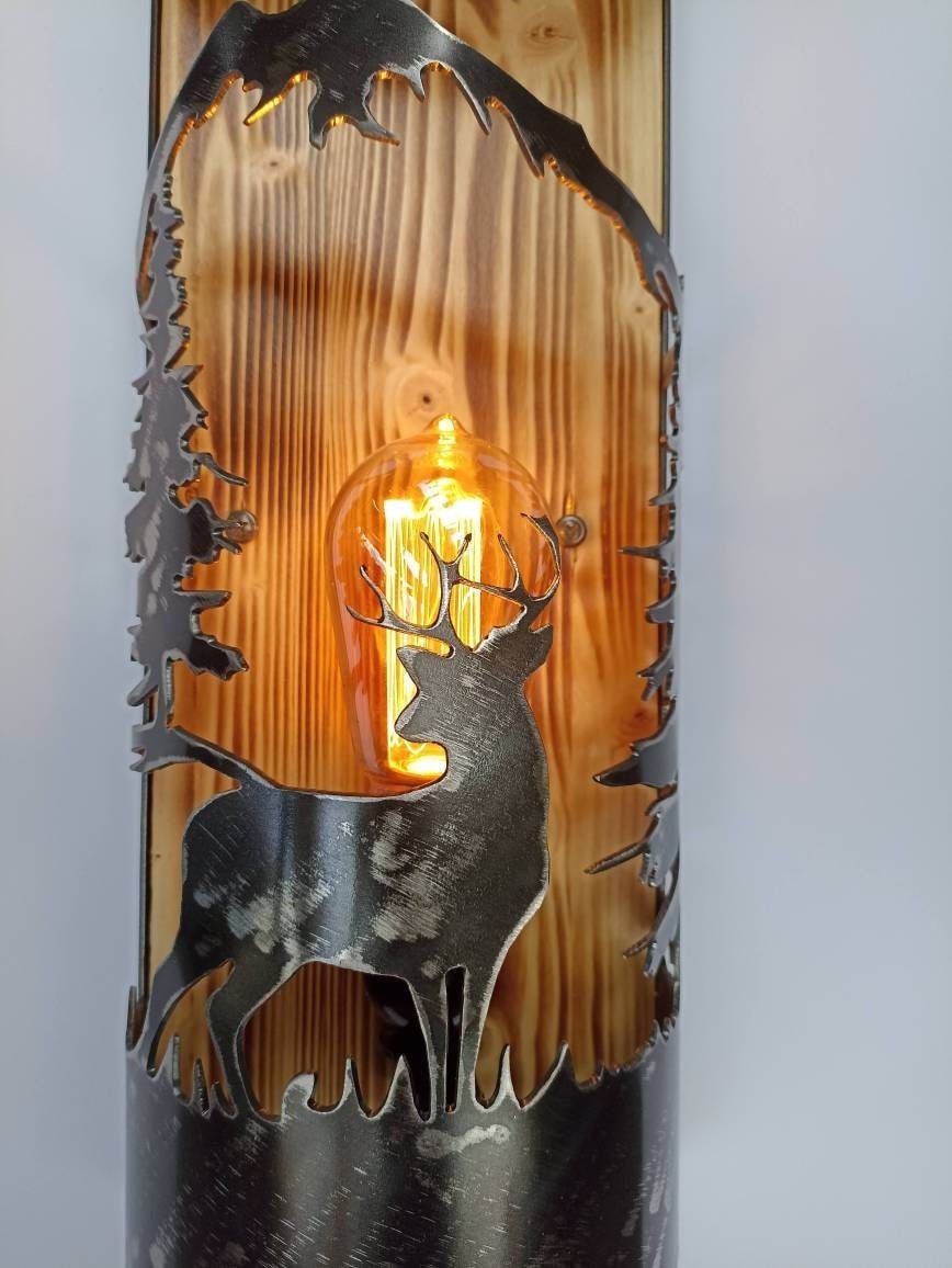Handmade deer silhouette wall sconce close up