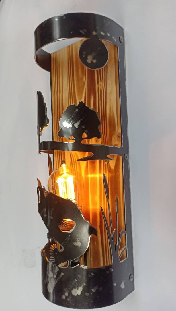 bass fish silhouette wall sconce close up