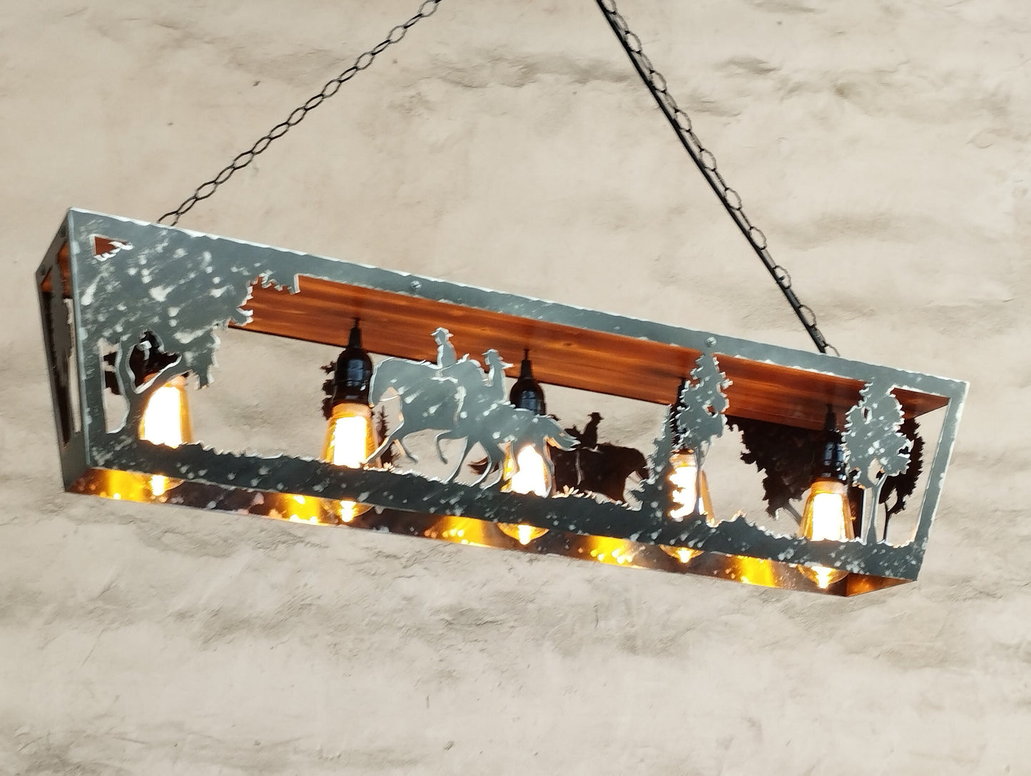 Rustic horse riders farmhouse light fixture illuminated