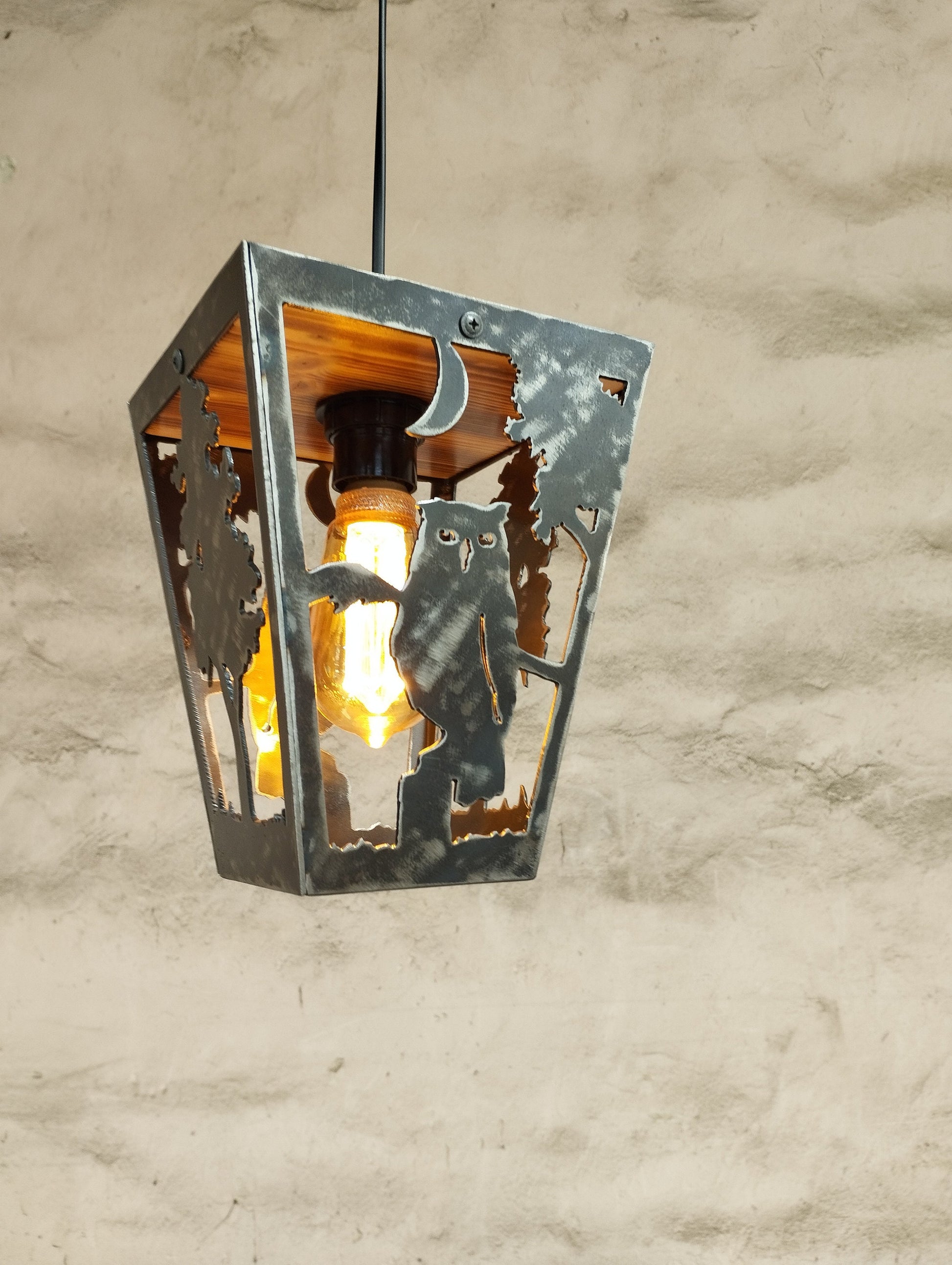 Owl log house pendant light illuminated amber bulb