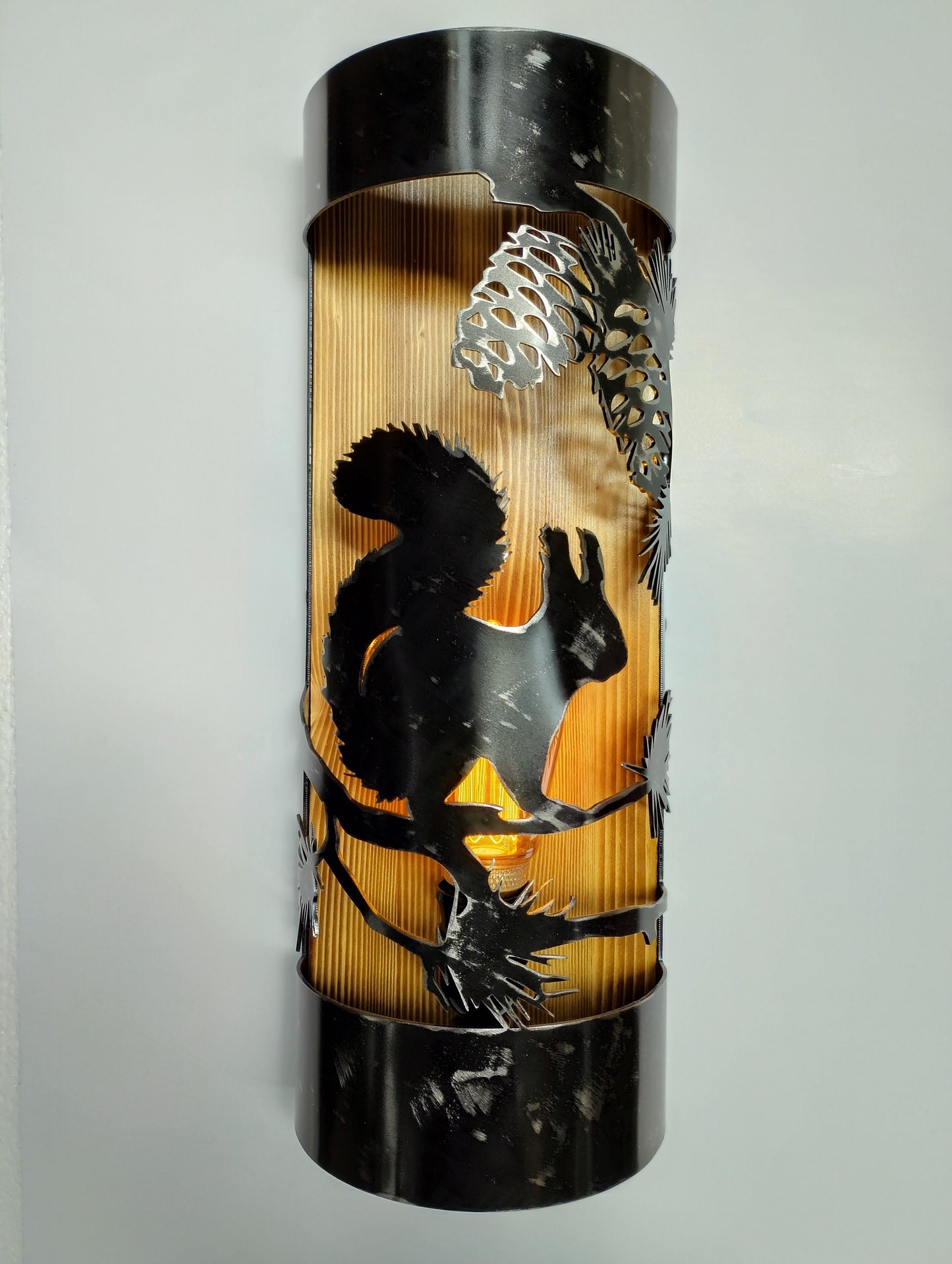 Squirrel pine cone rustic cabin wall sconce steel and wood