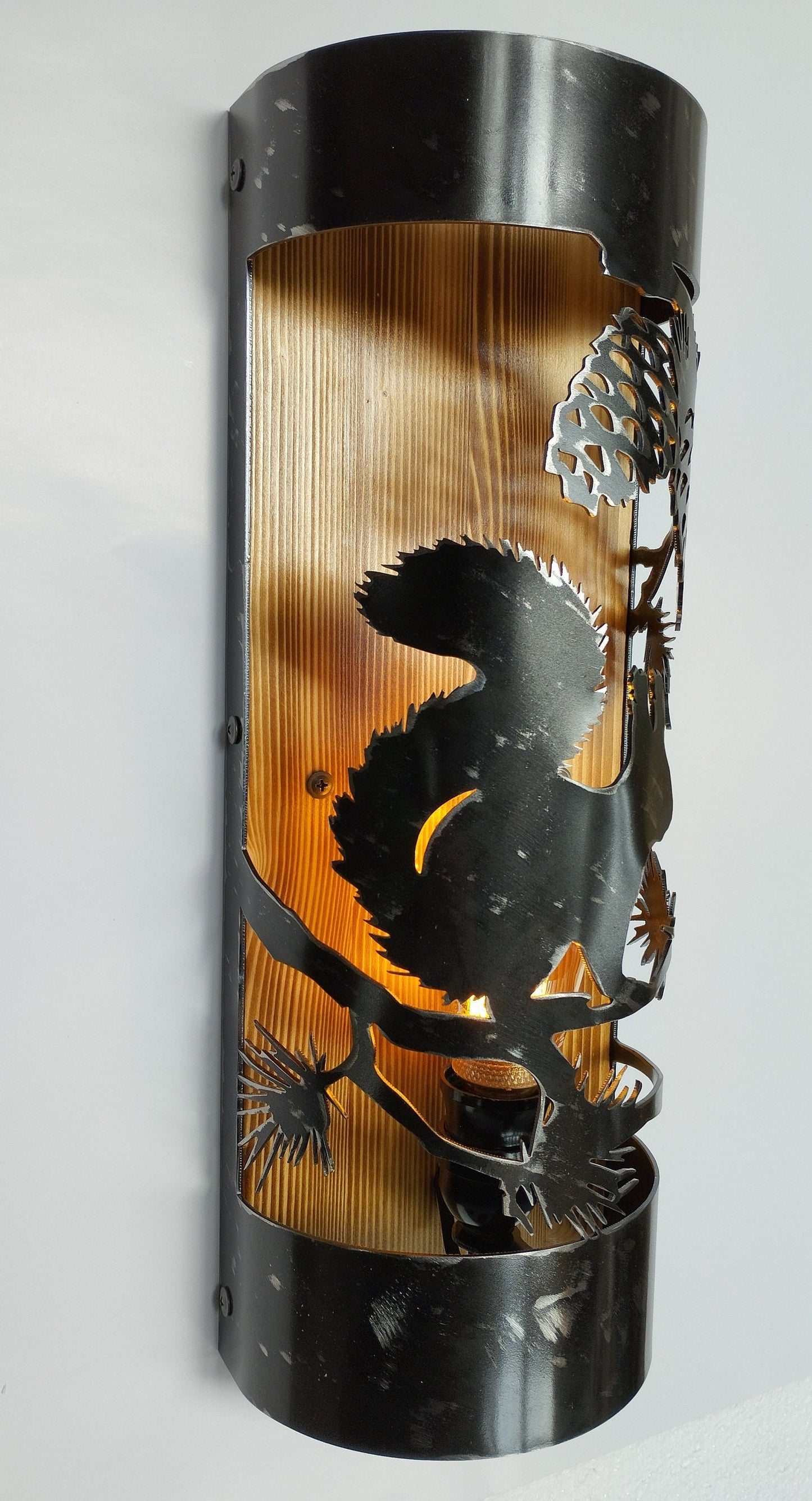 Rustic squirrel cottage wall light illuminated amber bulb