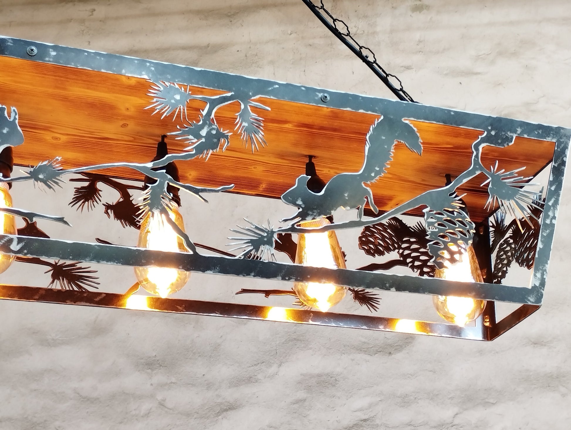Handcrafted squirrel silhouette ceiling light close up